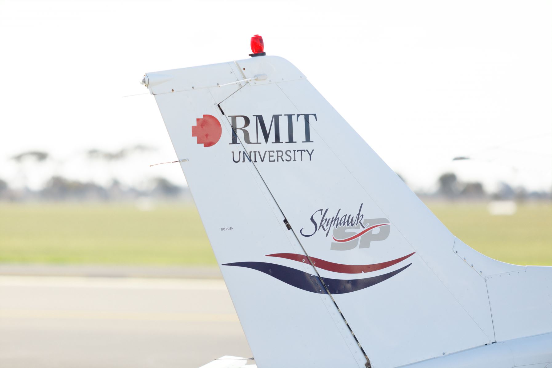 RMIT logo on the rear of an aeroplane